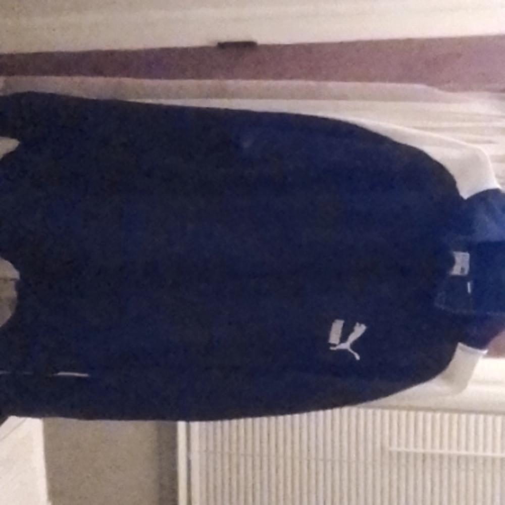 A Puma jacket with Puma lion on zipper